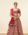 alt message - Mohey Women Maroon Embellished Bridal Lehenga image number 0